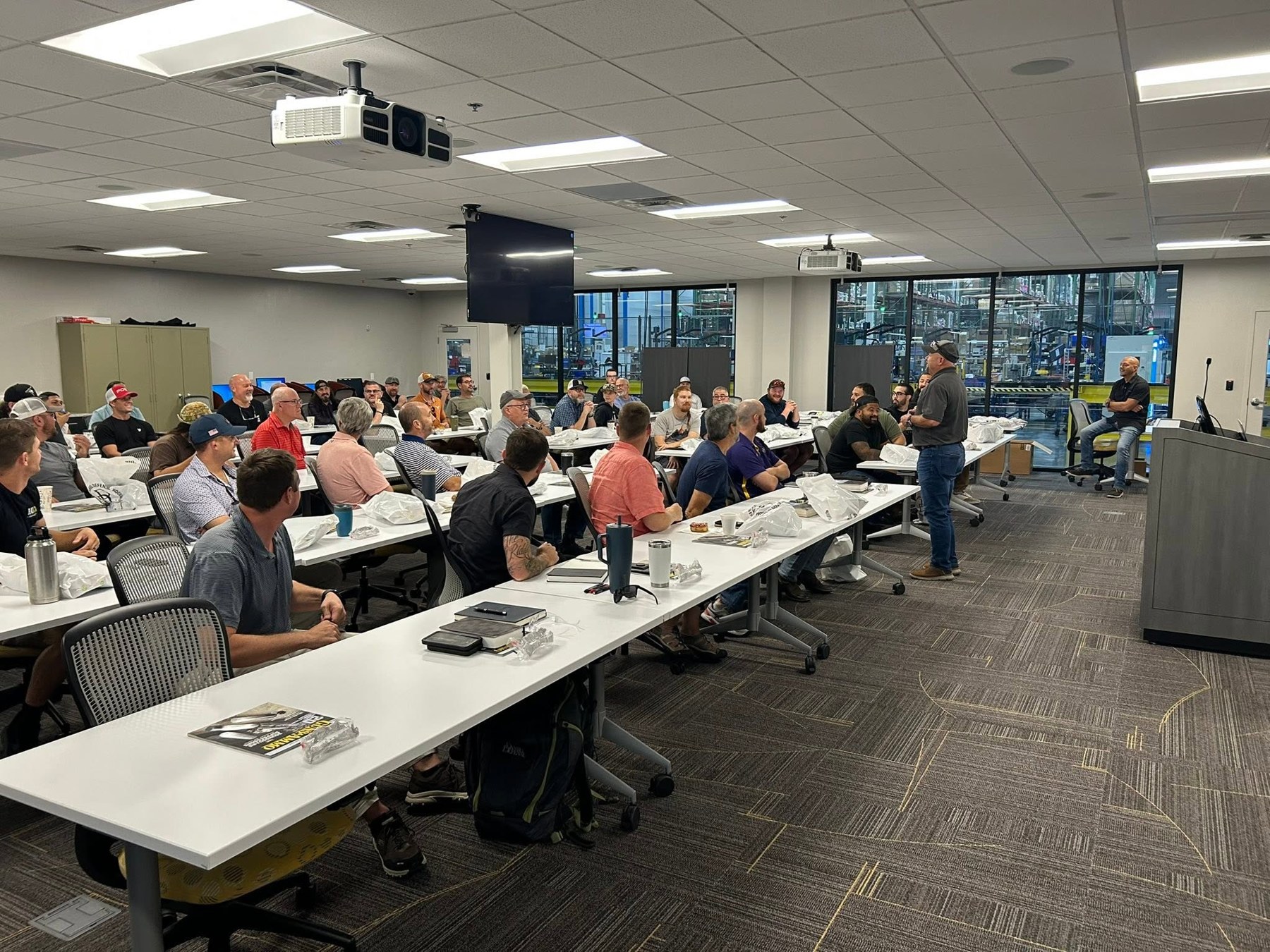 A Forge Bible study gathering seated around classroom tables